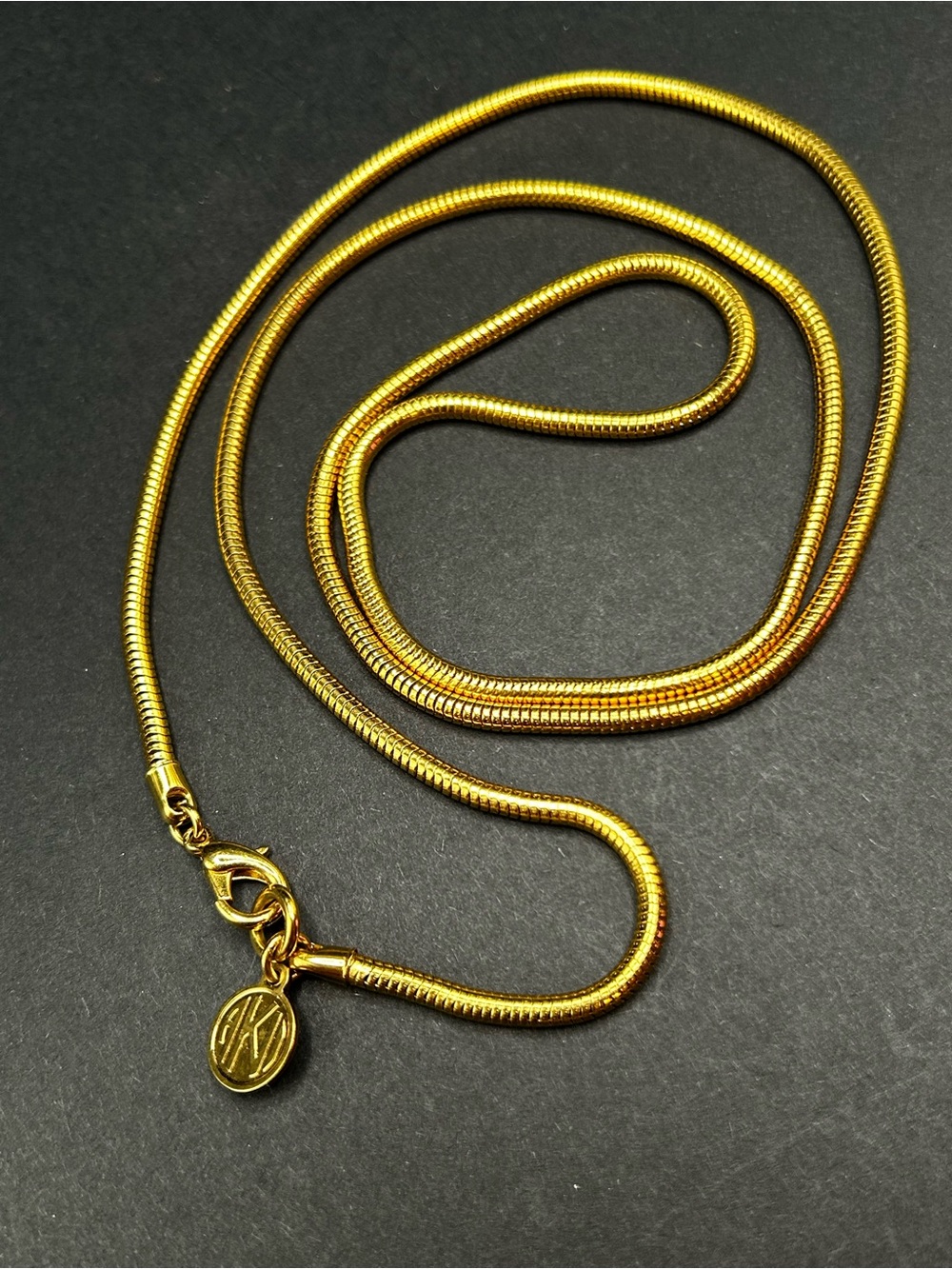 VTG Anne Klein Gold Tone Women's Snake Chain Necklace with Logo Charm Clasp 32” - Picture 1 of 6